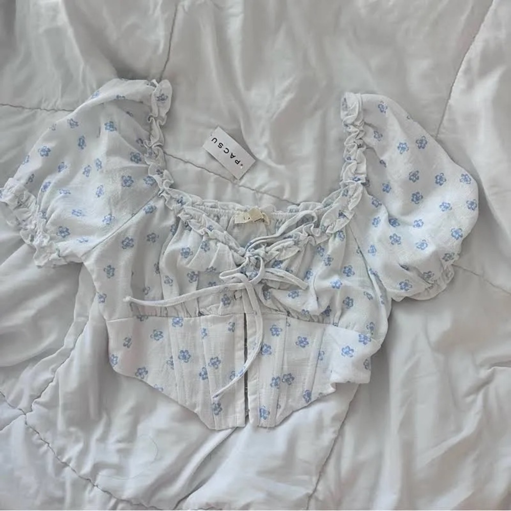 White corset top with blue florals